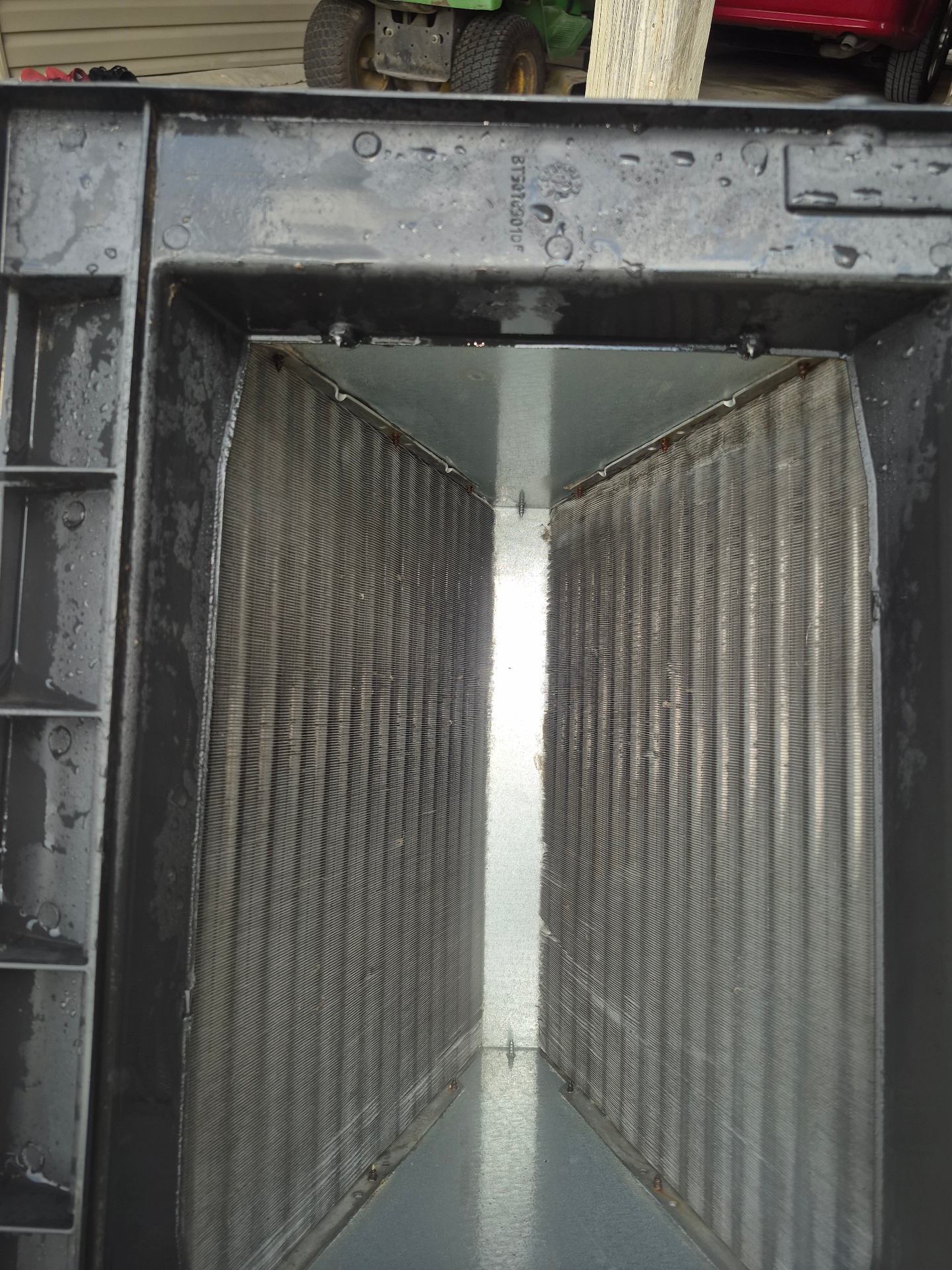 Evaporator coil fins viewed inside the air handler while inspecting the airflow path